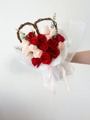 18 red and pink roses with heart-shaped willow branches and a touch of foliages